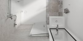 Ein modernes Badezimmer mit eleganten Fliesen, einer freistehenden Badewanne und einer stilvollen Duschabtrennung aus Glas.